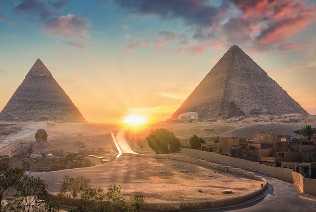 View of The Great Sphinx, Pyramid of Khafre and Great Pyramid of Giza at sunset, Cairo, Giza, Egypt